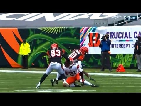 Denzel Ward slides under a blocker to make the tackle
